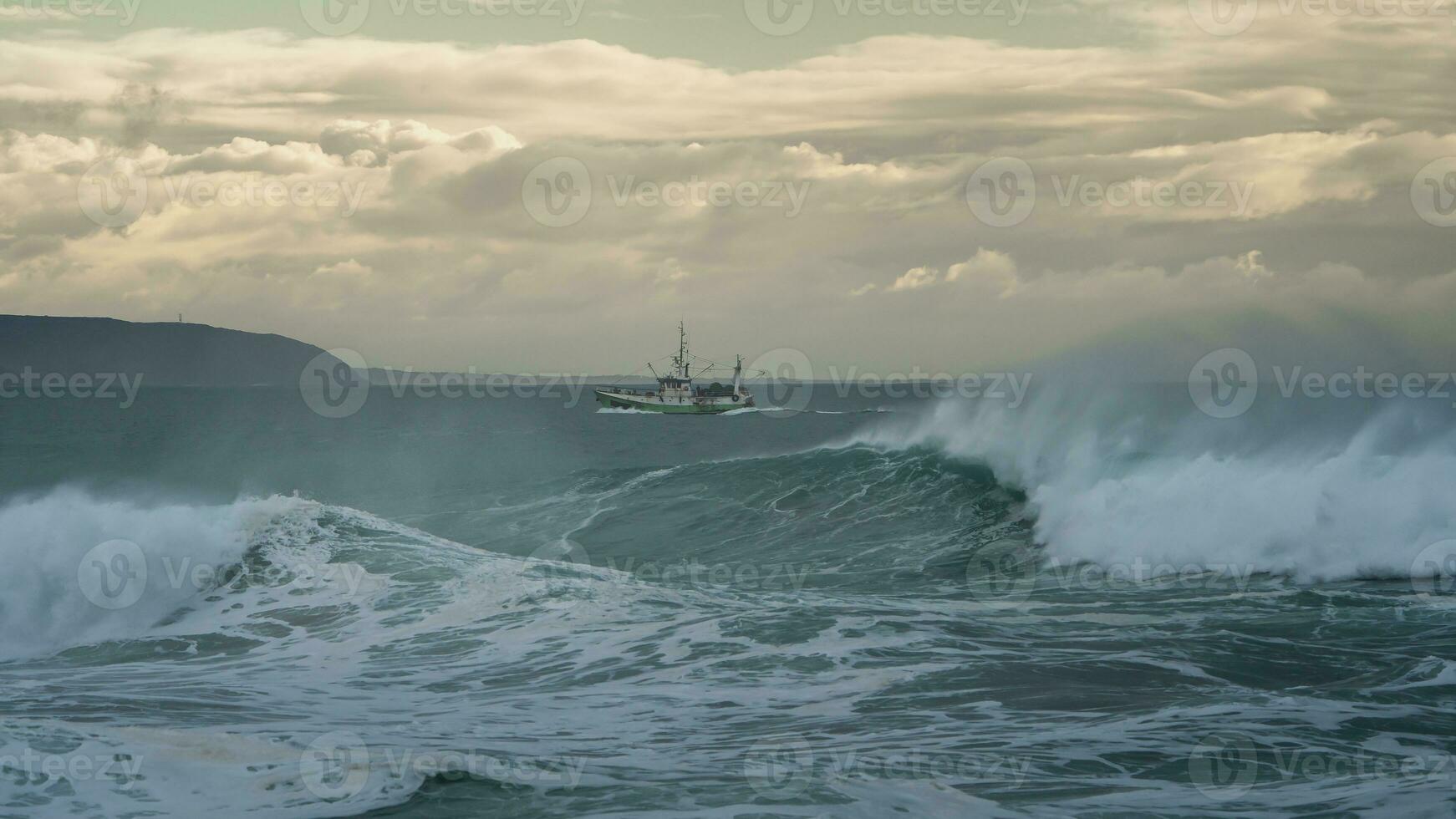 Fishing boat off the coast of Portugal near Nazare photo