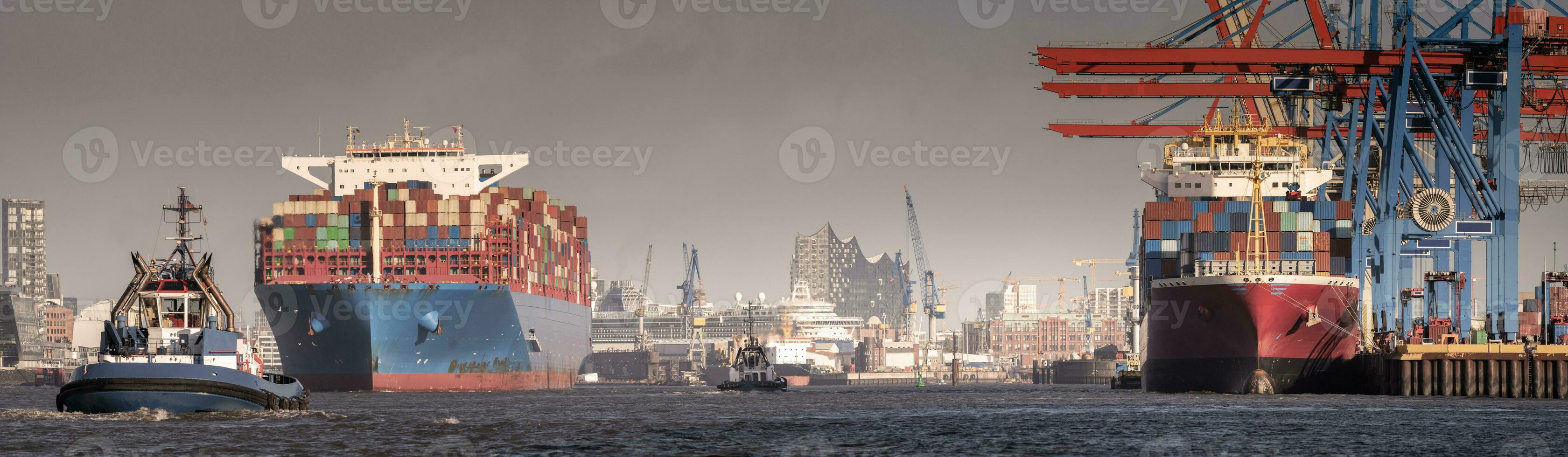 A container ship at the terminal in reasonably good weather in Hamburg photo