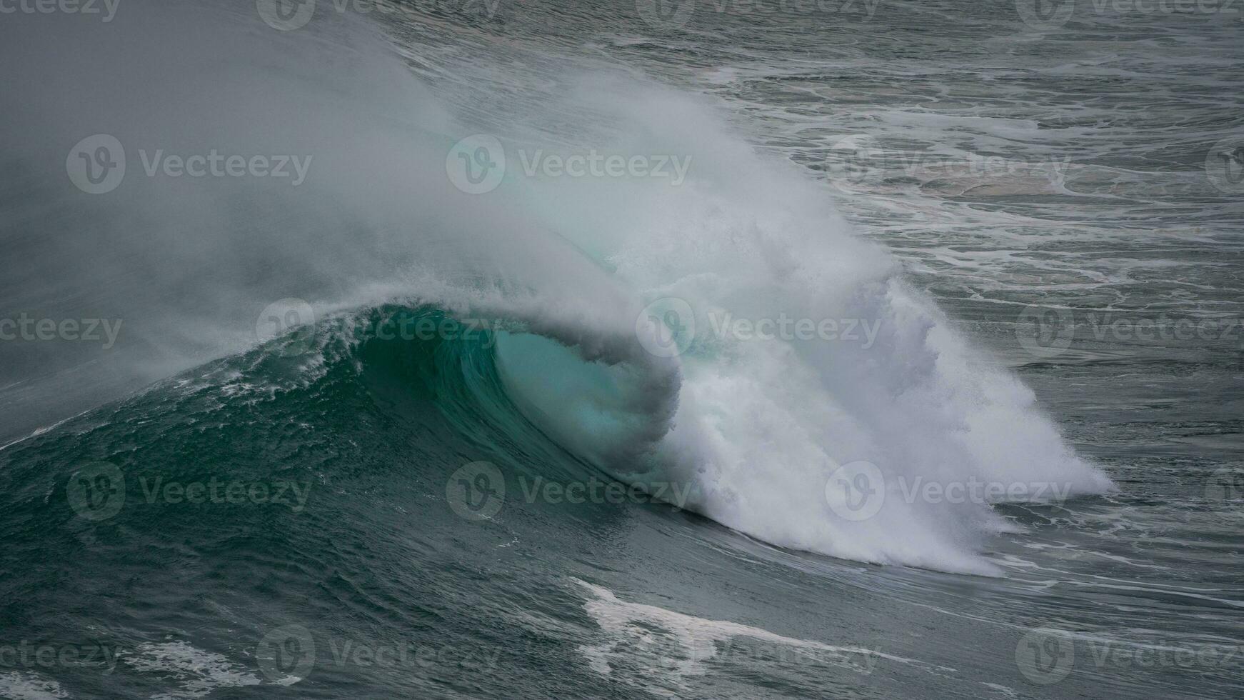 Close up of waves of the atlantic at sunset near nazare photo