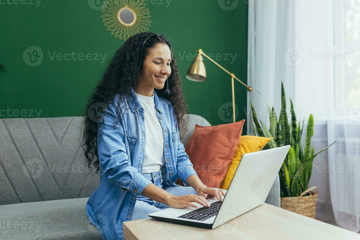 Happy hispanic woman at home working remotely from home, customer 