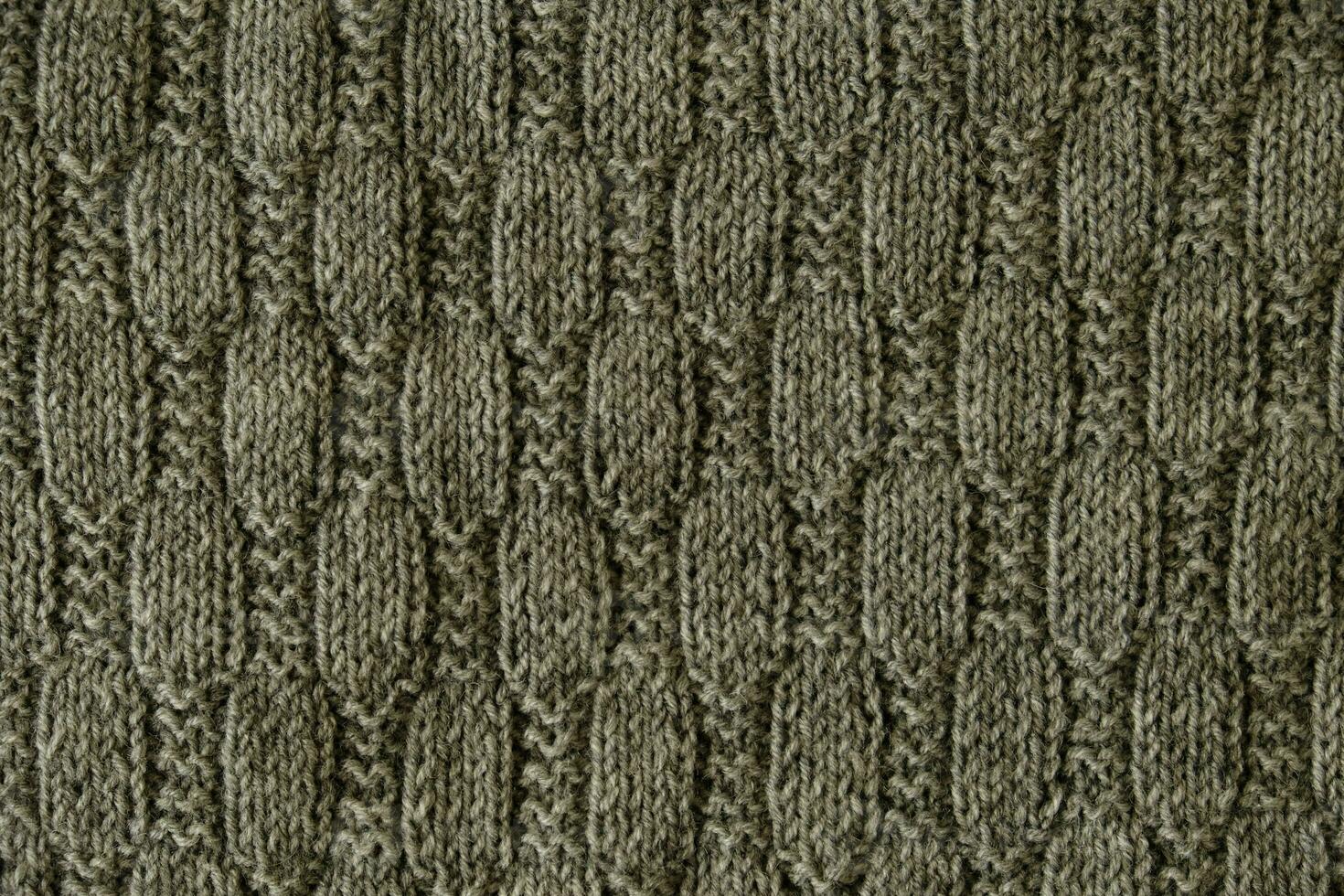 Texture of smooth knitted gray sweater with pattern. Top view close up. Handmade knitting wool or cotton fabric texture. Background with knitted leaf shape knitting pattern with cables. 35209867 Stock...