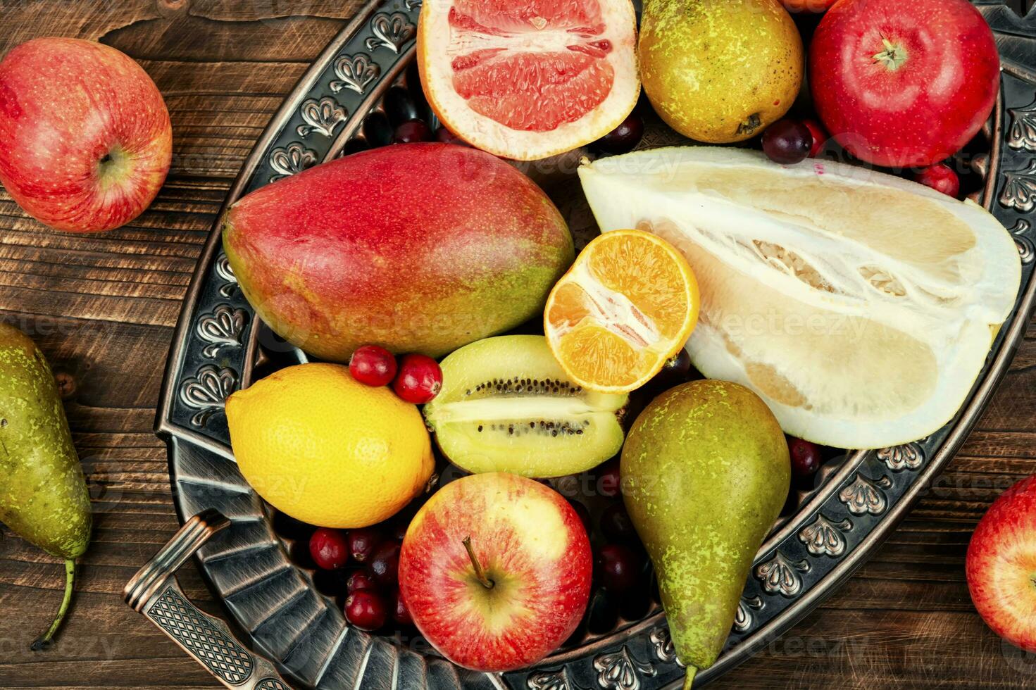 Assortment of fruits on a vintage tray. photo