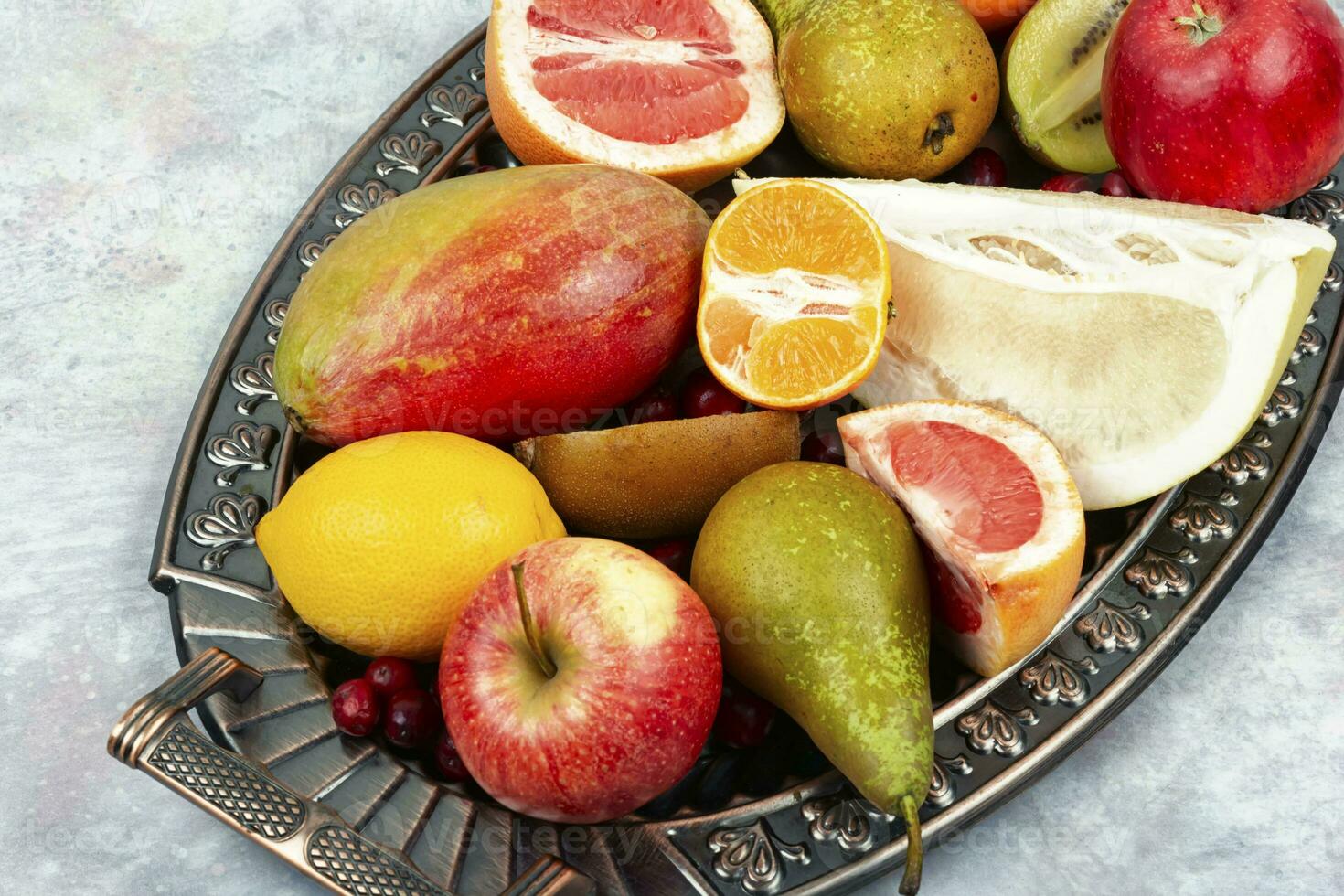 Assortment of fruits on a vintage tray. photo