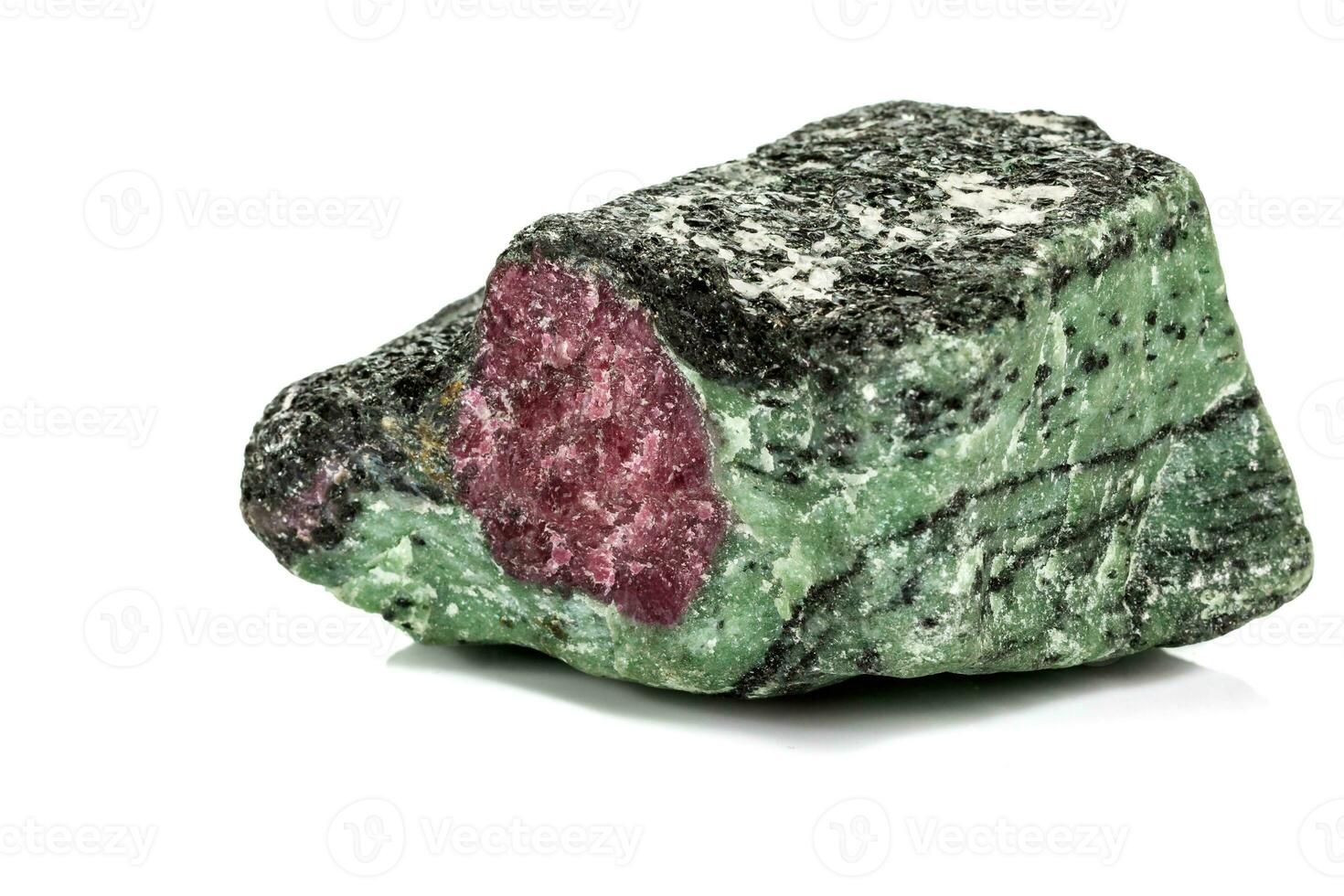 Macro of mineral stone ruby in rock on white background photo