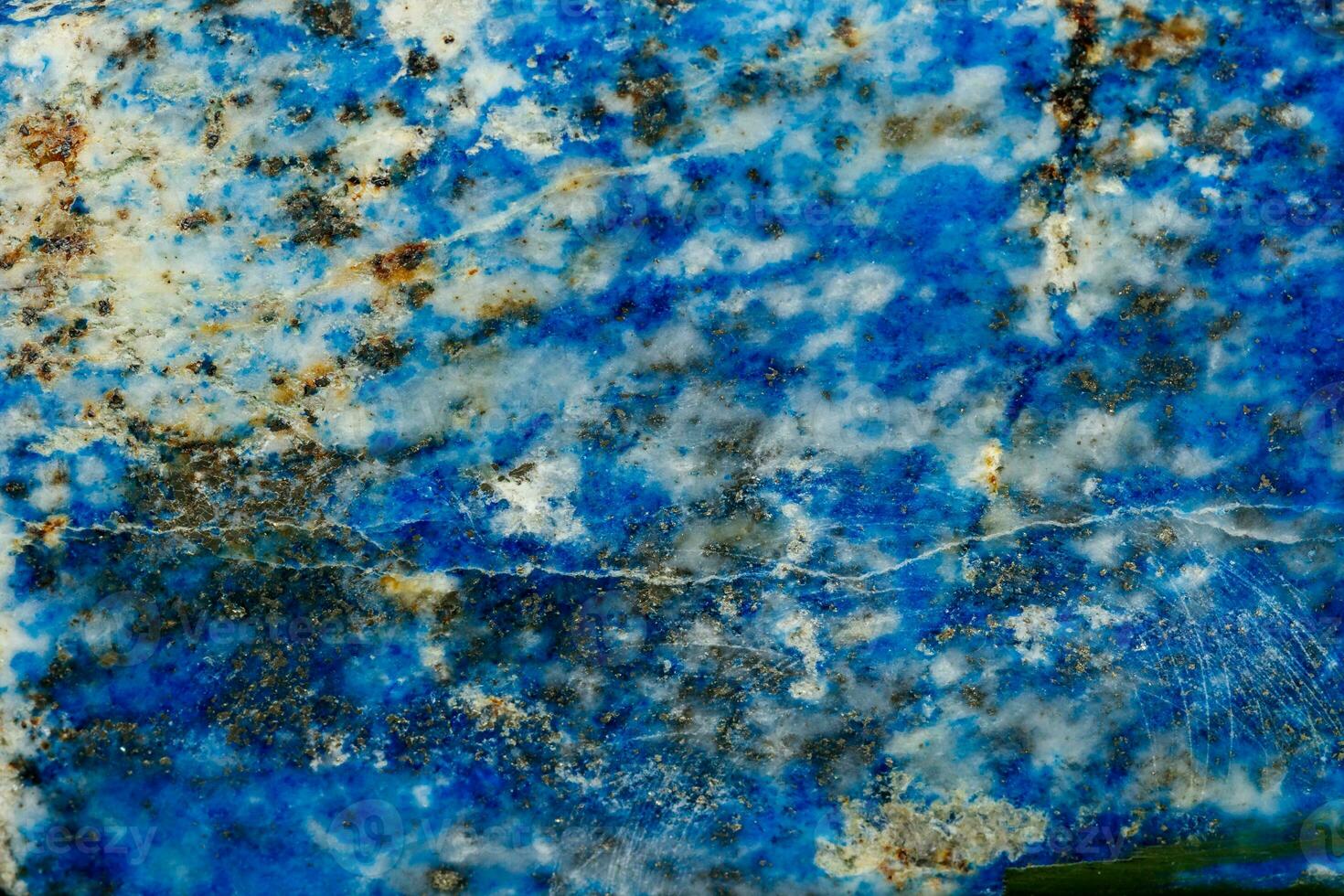 Macro of mineral stone Lazurite on a black background photo