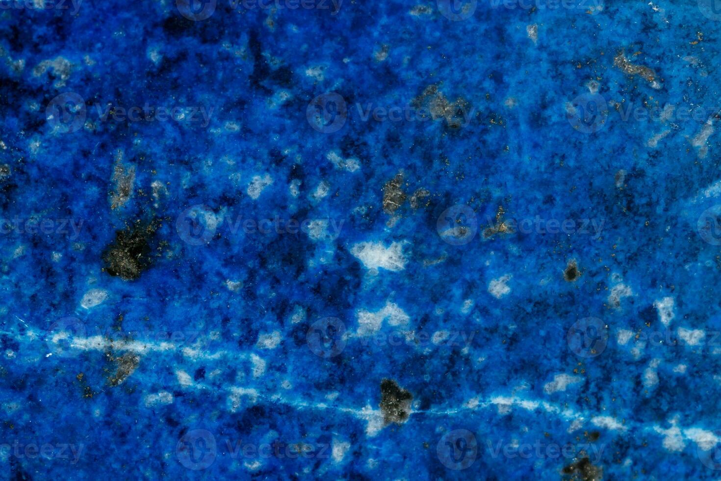 Macro of mineral stone Lazurite on a black background photo