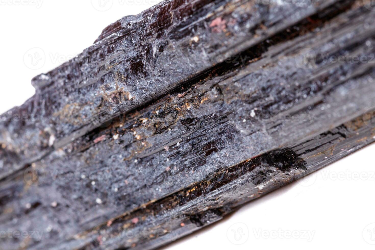 macro mineral stone sherle, schorl, black tourmaline on white background photo