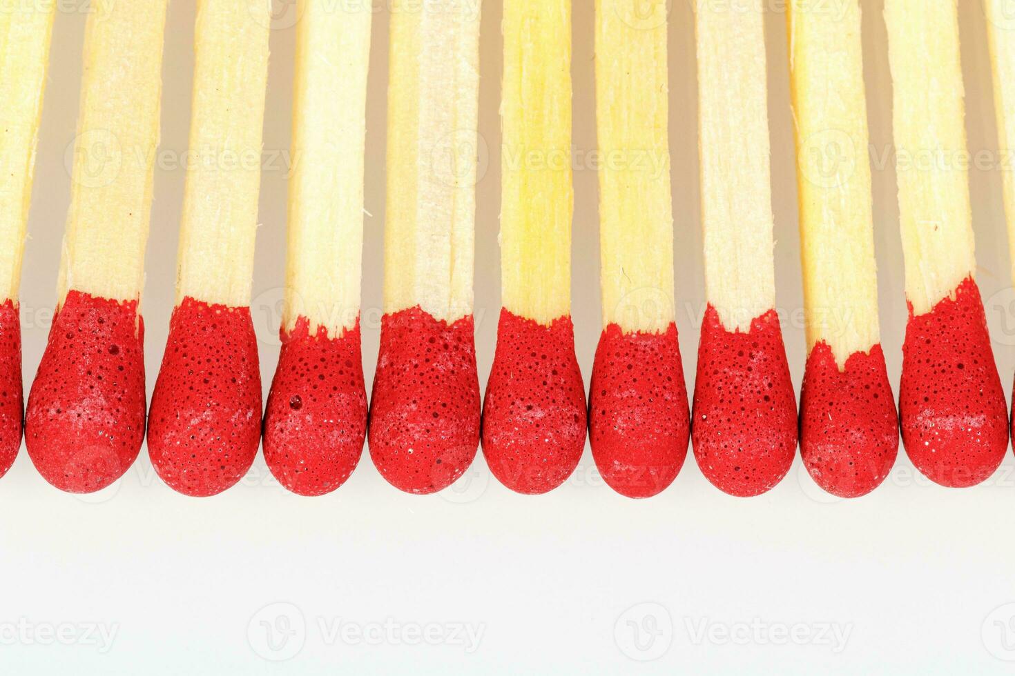 matches with a red head on a white background photo