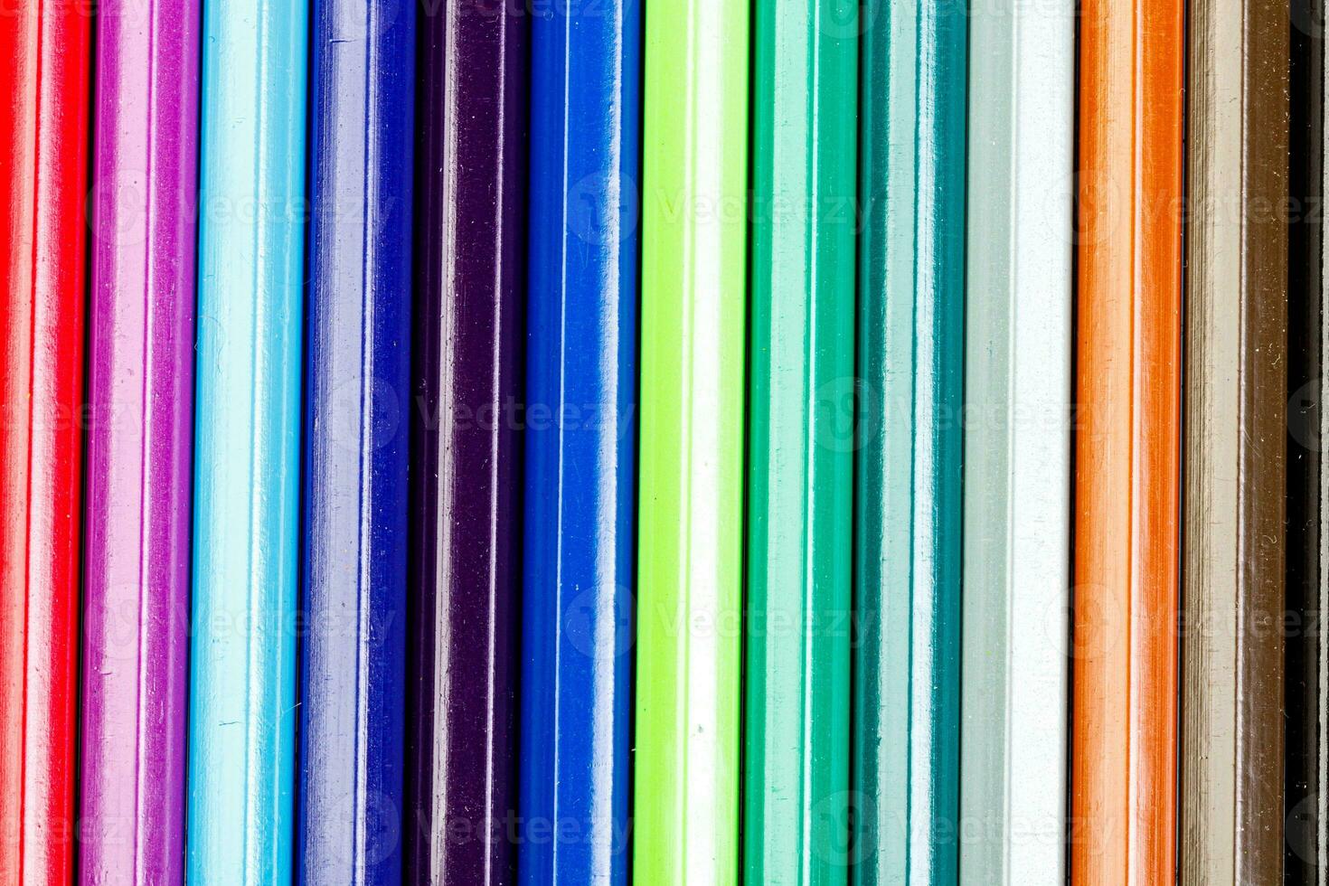 macro multicolored pencils on a white background photo