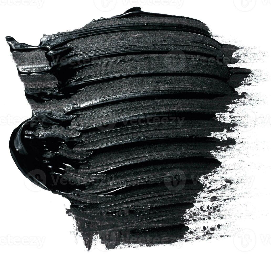 Black paint stroke with bristle brush, swatch isolated on white background photo