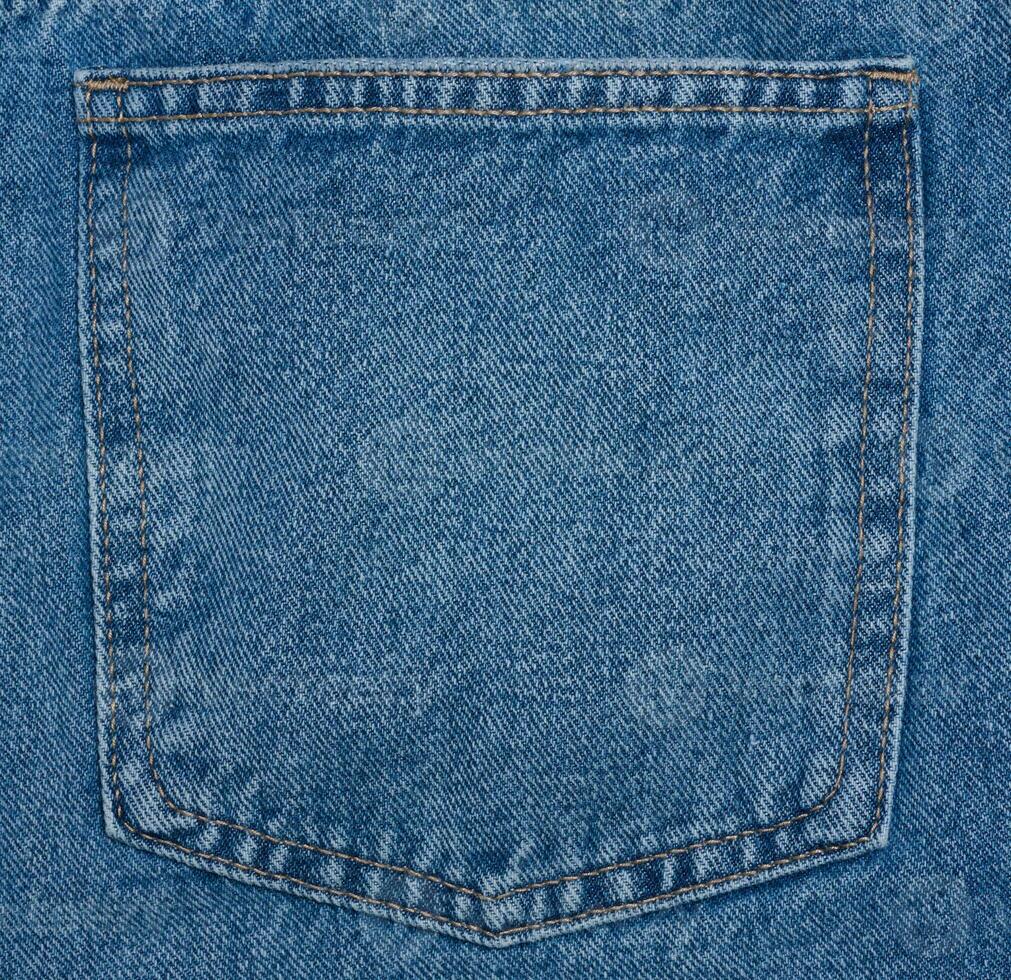 Back pocket of blue jeans photo