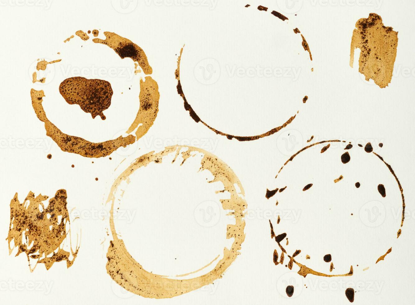 Imprint of spilled black coffee on a white isolated background photo