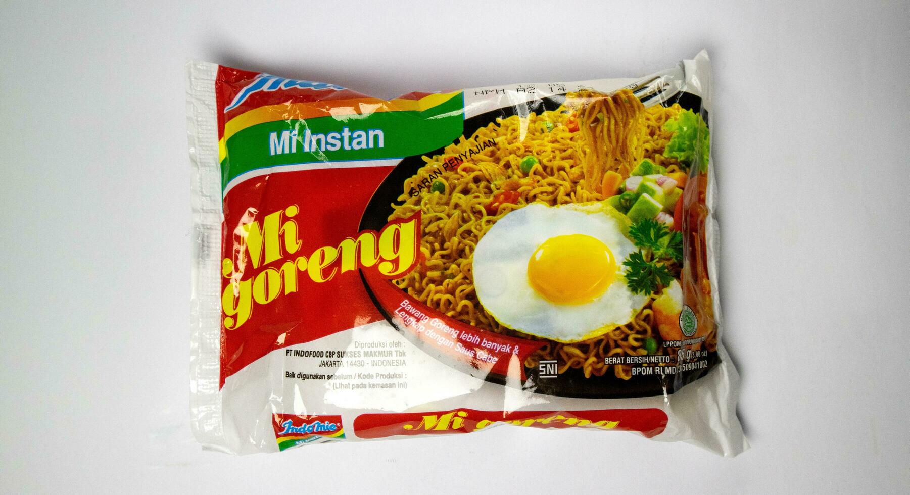 Indomie fried noodles or Indomie Goreng on white background. Indonesian instant noodles. Jawa Barat, 5 Desember 2023 photo