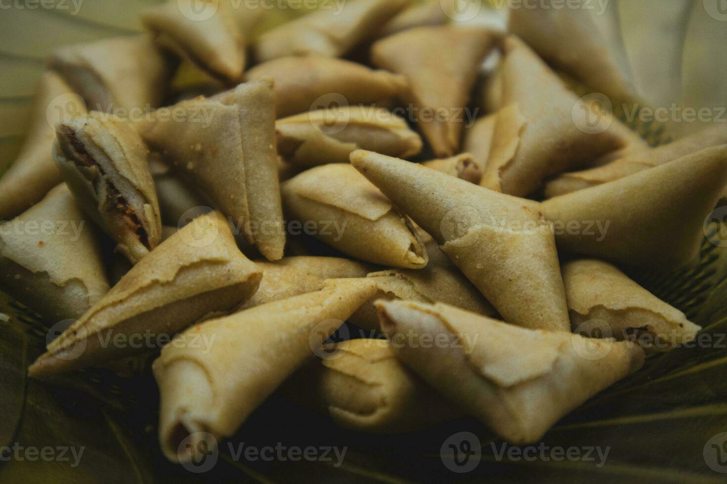 samosa or pakora on plate. indian or pakistani snacks. photo