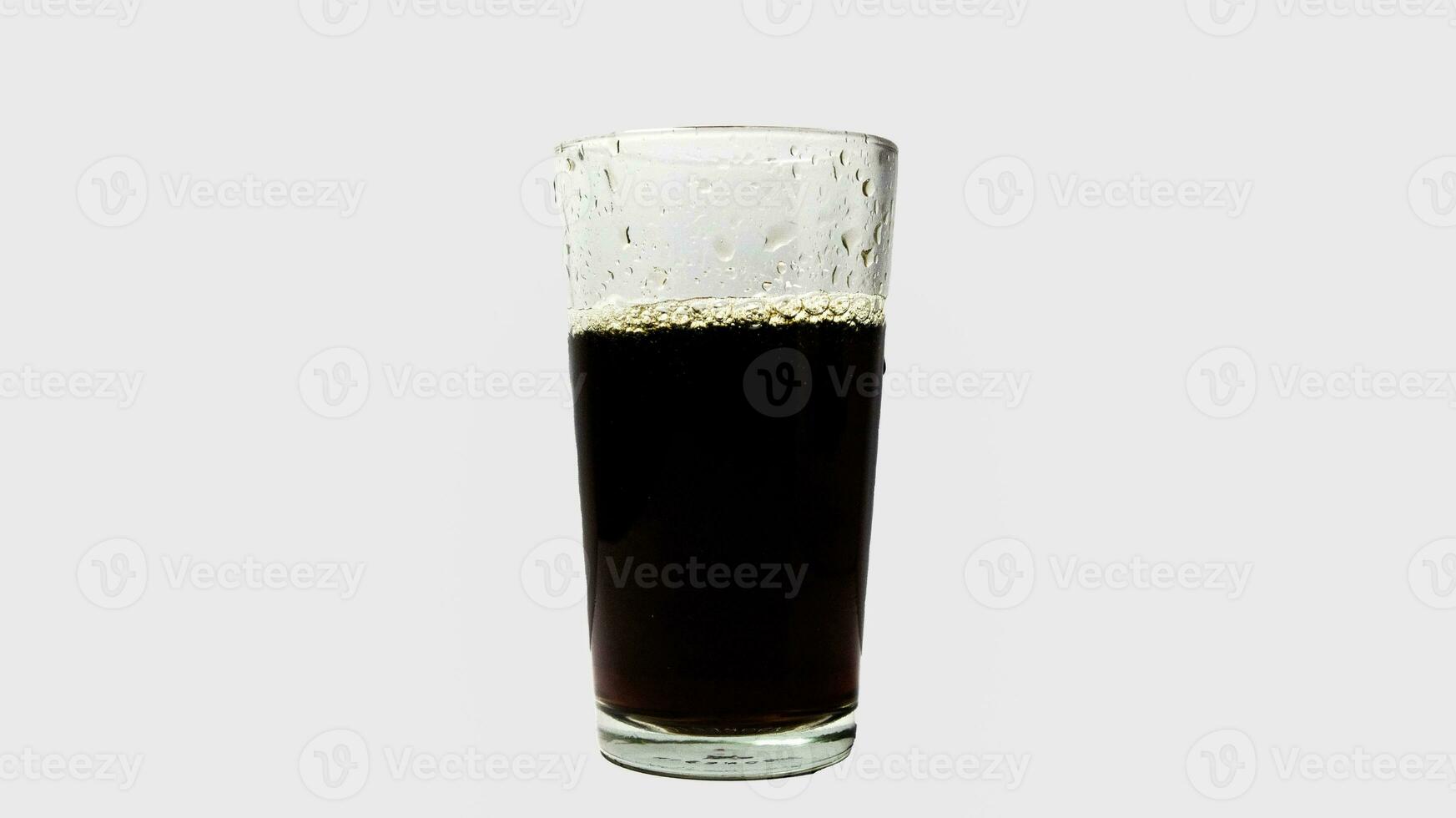 Soda in transparent glass isolated on a white background. photo