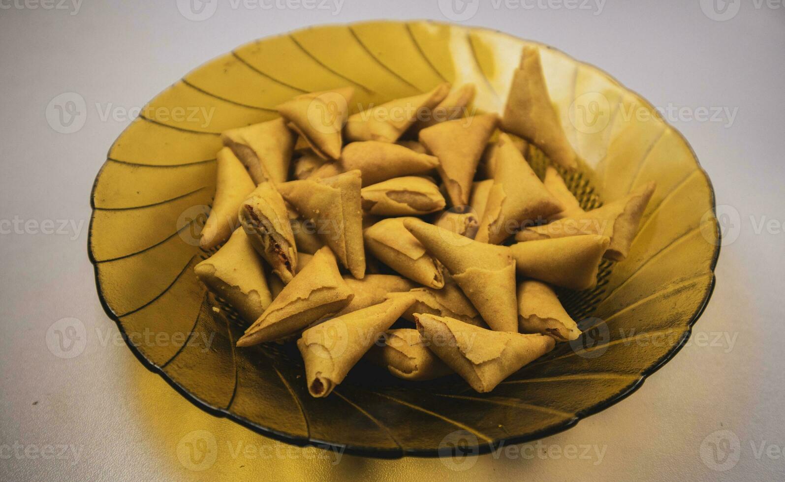 samosa or pakora on plate. indian or pakistani snacks. photo