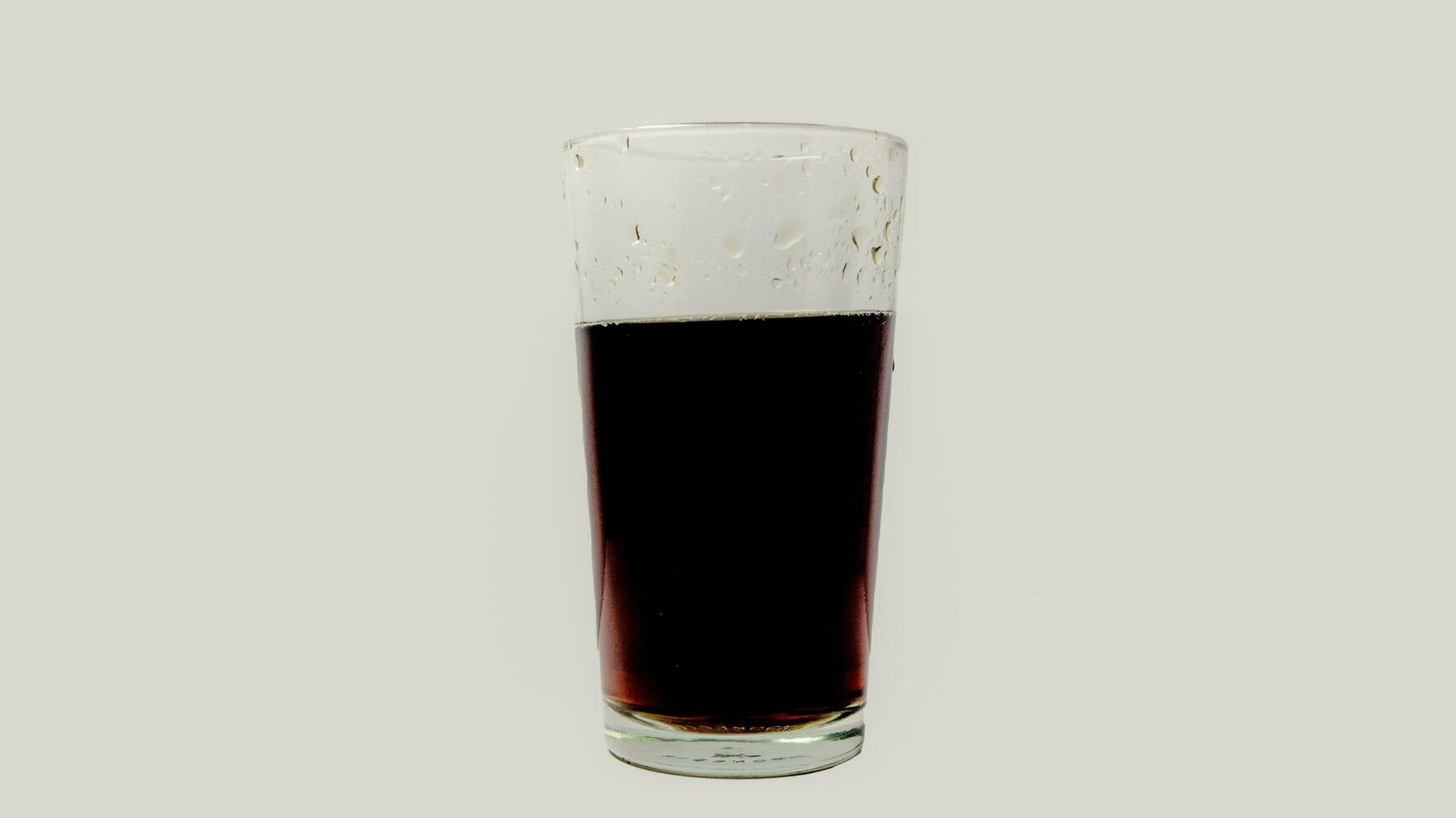 Soda in transparent glass isolated on a white background. photo