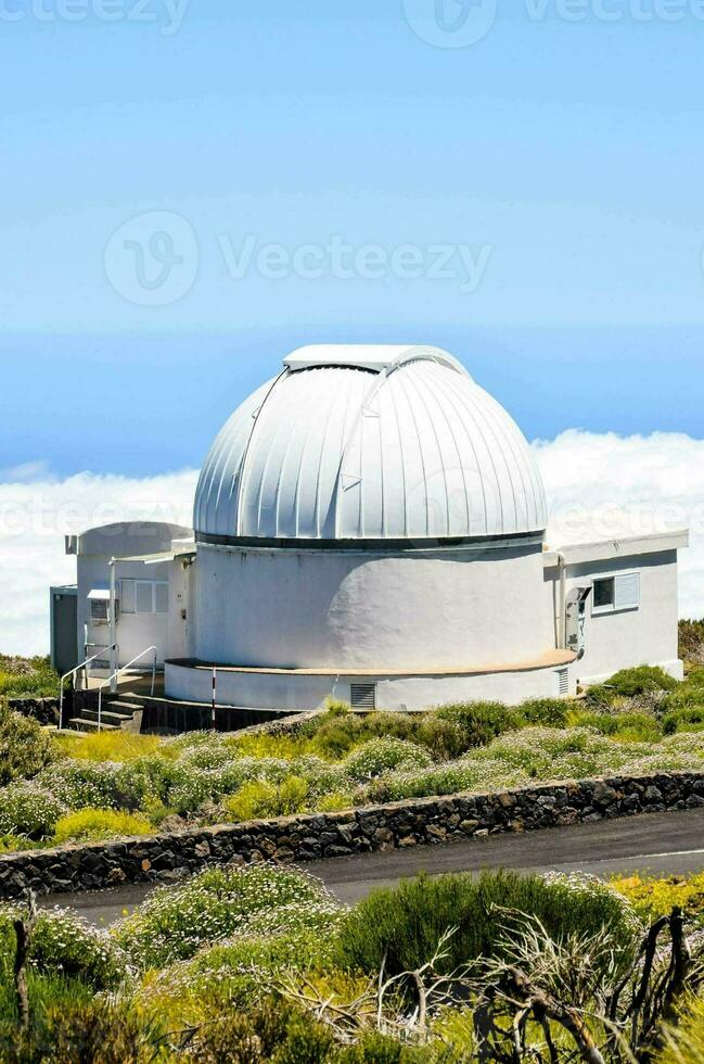 an observatory sits on top of a hill photo