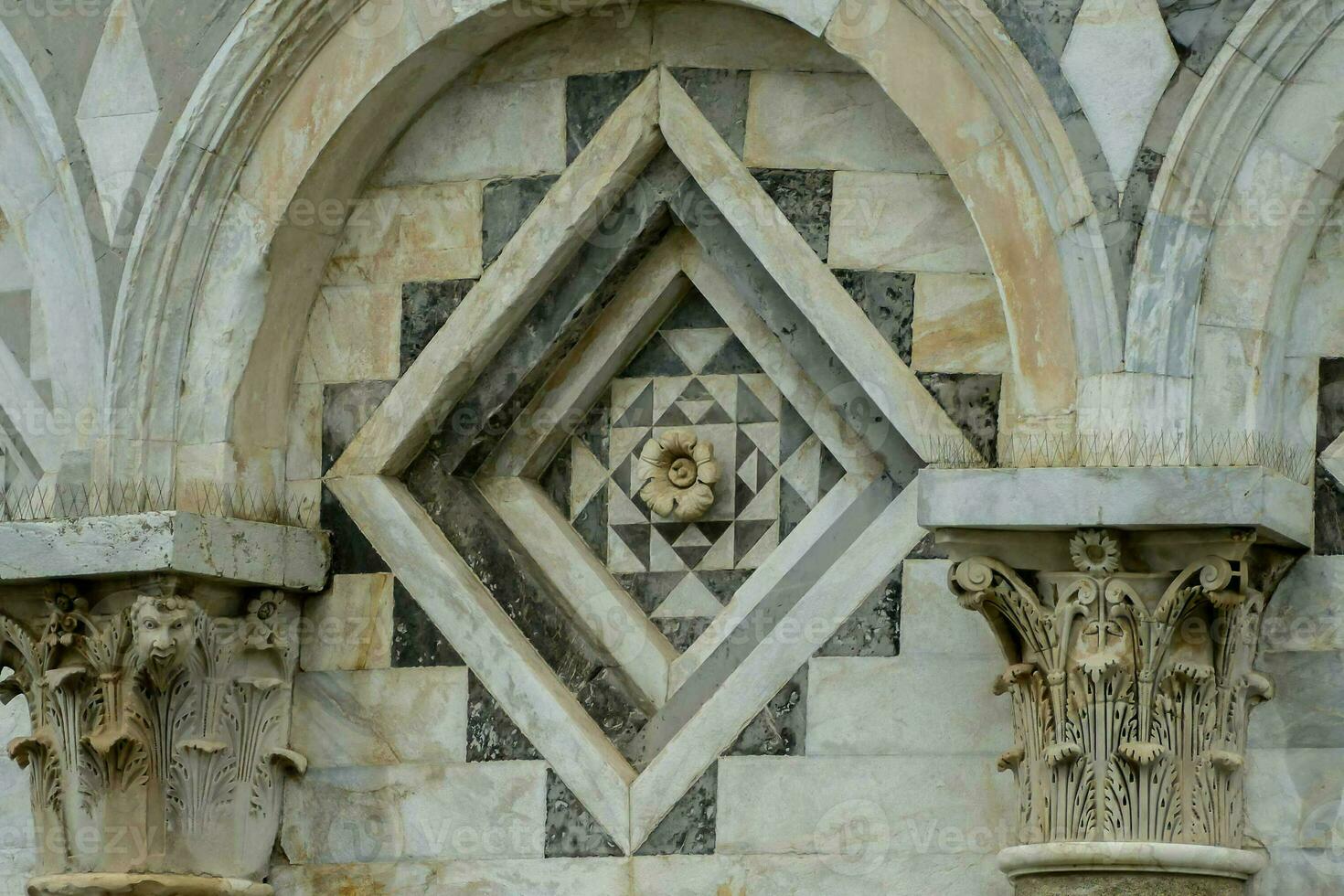 the facade of a building has a large stone design photo