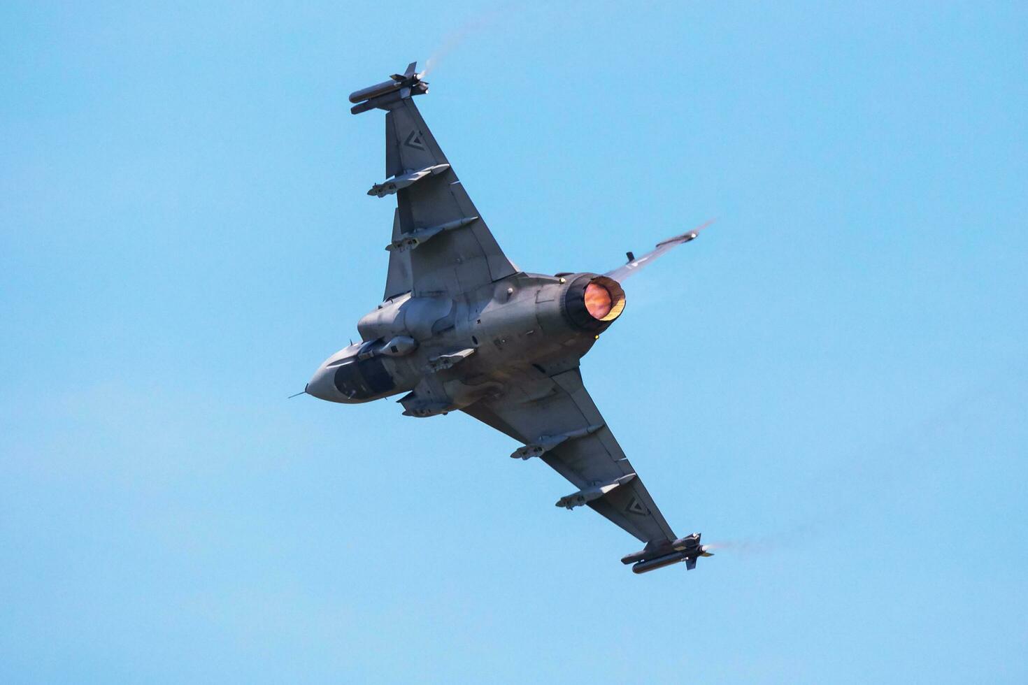 Hungarian Air Force SAAB JAS 39 Gripen. Military fighter jet plane at air base. Flight operation. Aviation and aircraft. Air defense. Fly and flying. photo