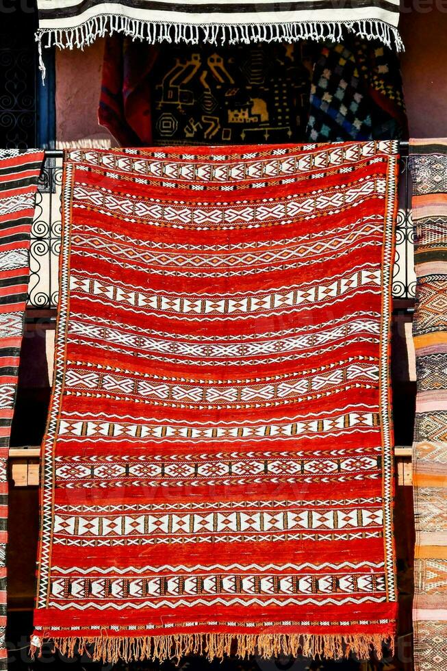 a colorful rug is displayed in front of a store photo
