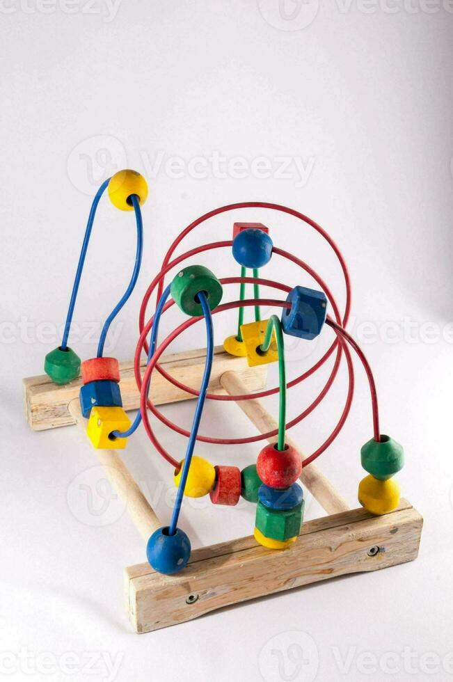 a wooden toy with colorful beads on it photo