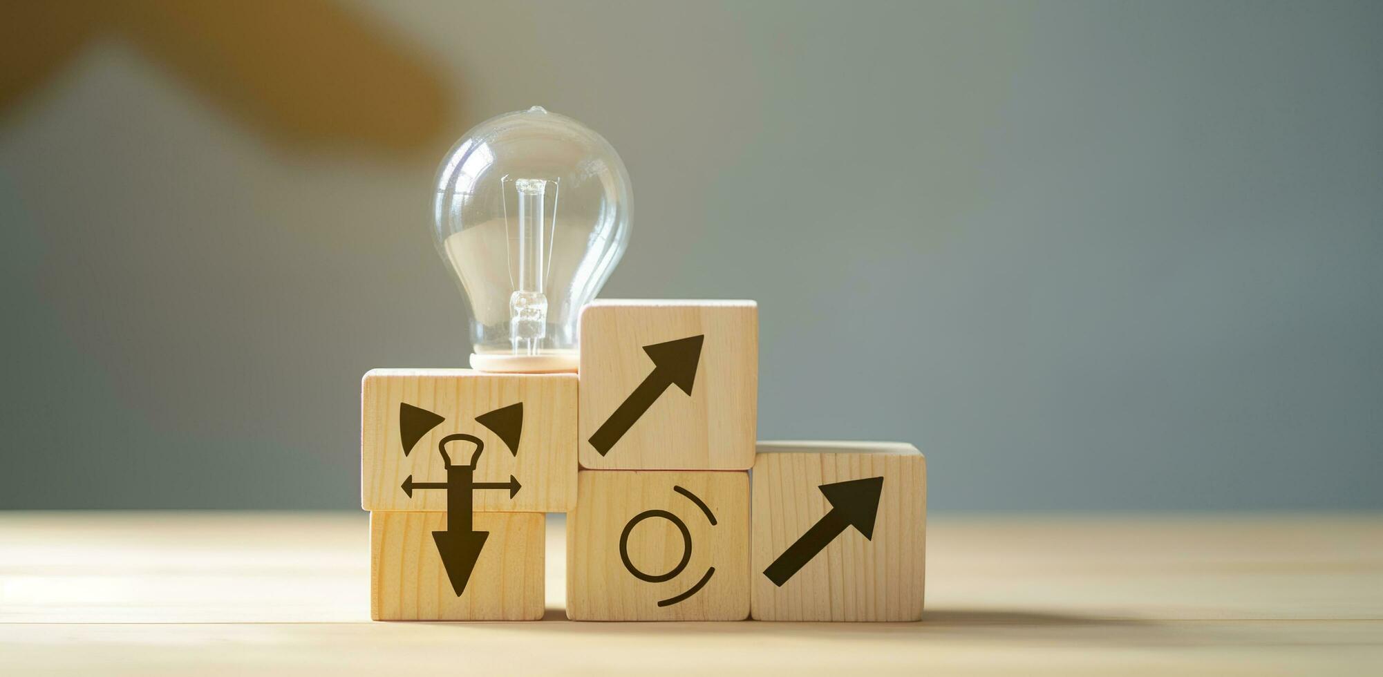 AI generated Creative idea, solution and innovation concept. Idea generation for business development. Wooden cube blocks with light bulb and cycle icons on clean background and copy space. photo