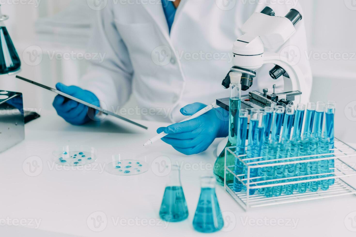 microscope with lab glassware, science laboratory research and development concept photo