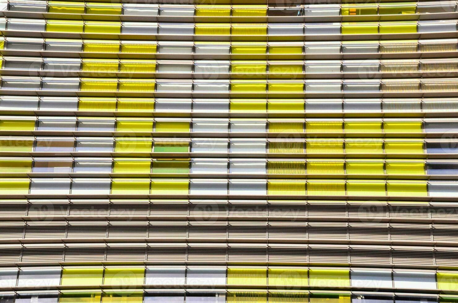 a yellow and white building with many windows photo