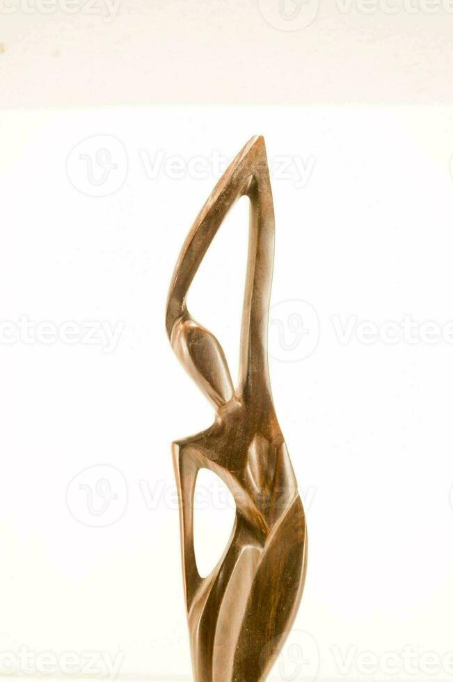 a bronze sculpture of a woman photo