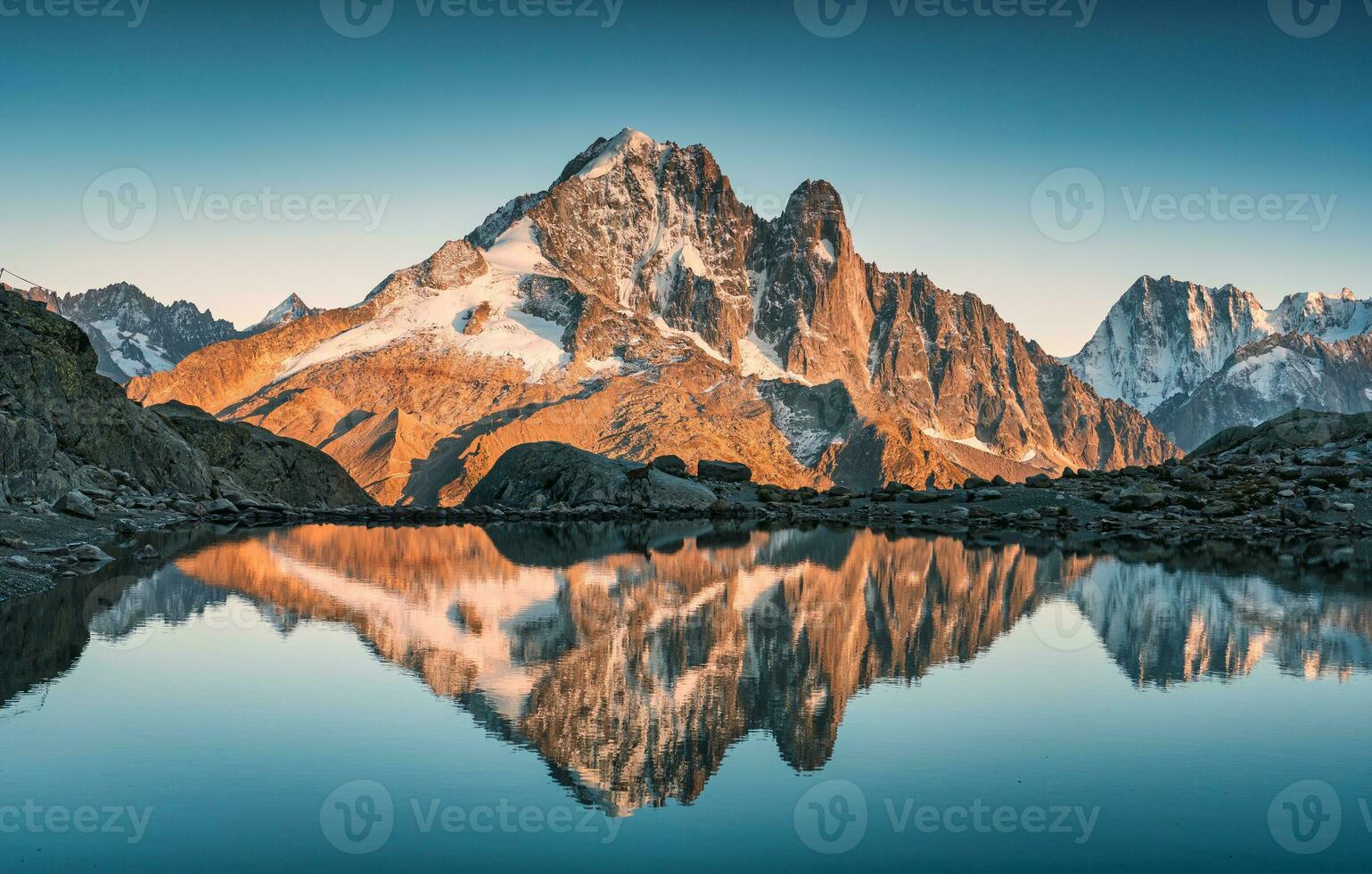 French alps landscape of Lac Blanc with Mont Blanc mountain range reflected on lake in the sunset at Chamonix, France photo