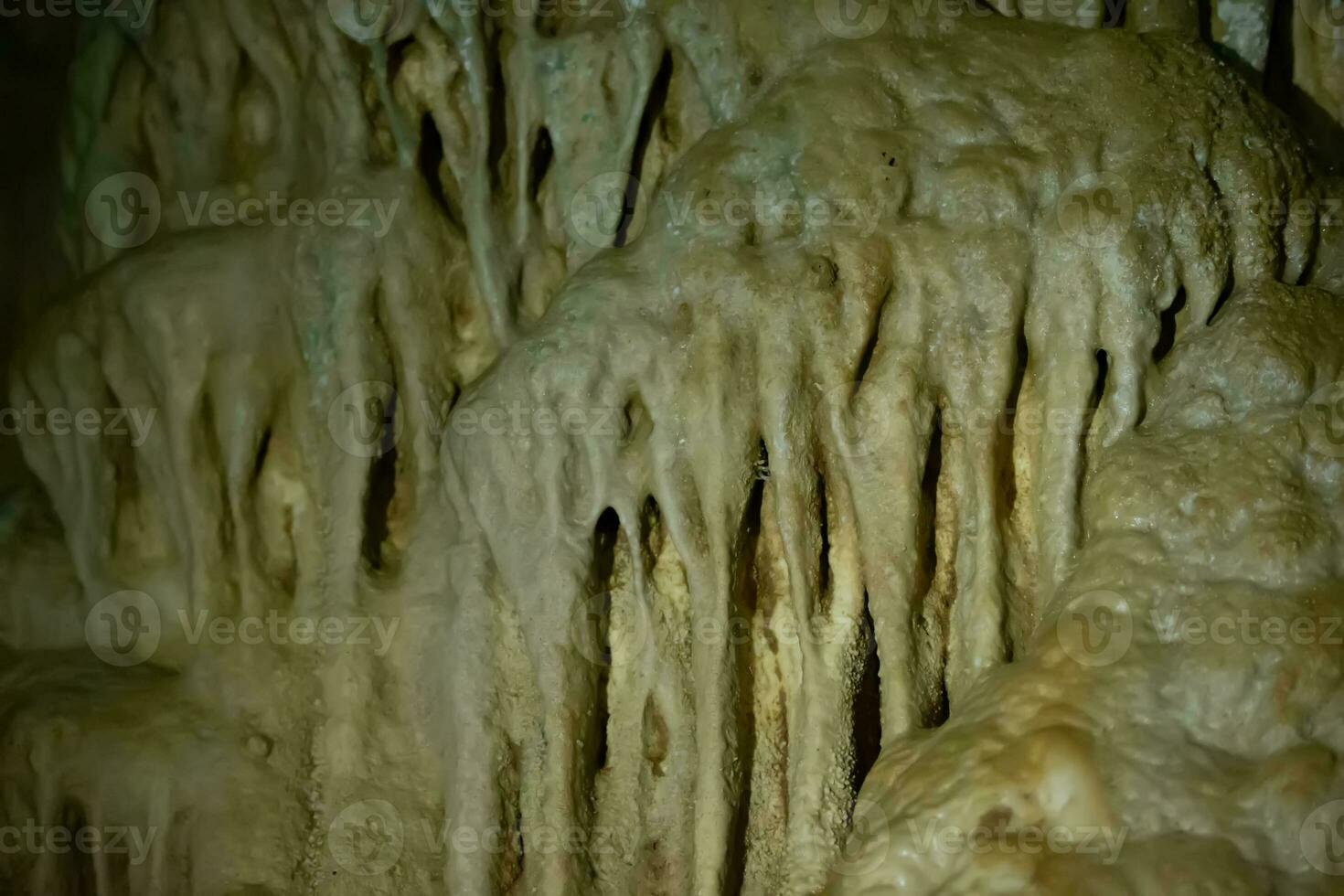 The cave is karst, amazing view of stalactites and stalagnites illuminated by bright light, a beautiful natural attraction in a tourist place. photo