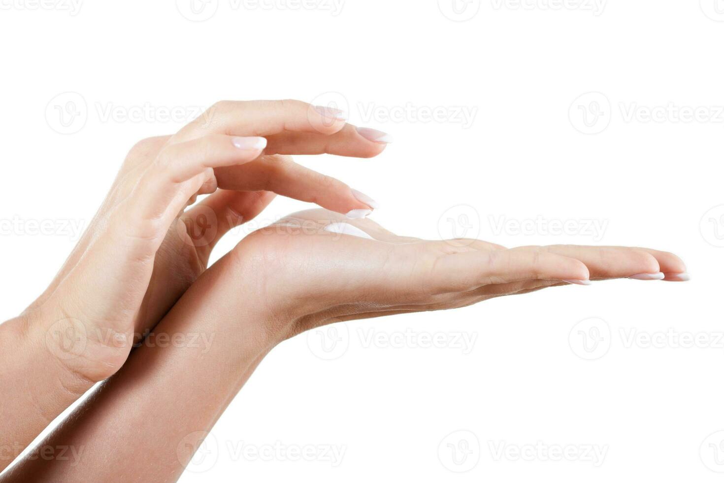 Applying moisturizer on hand photo