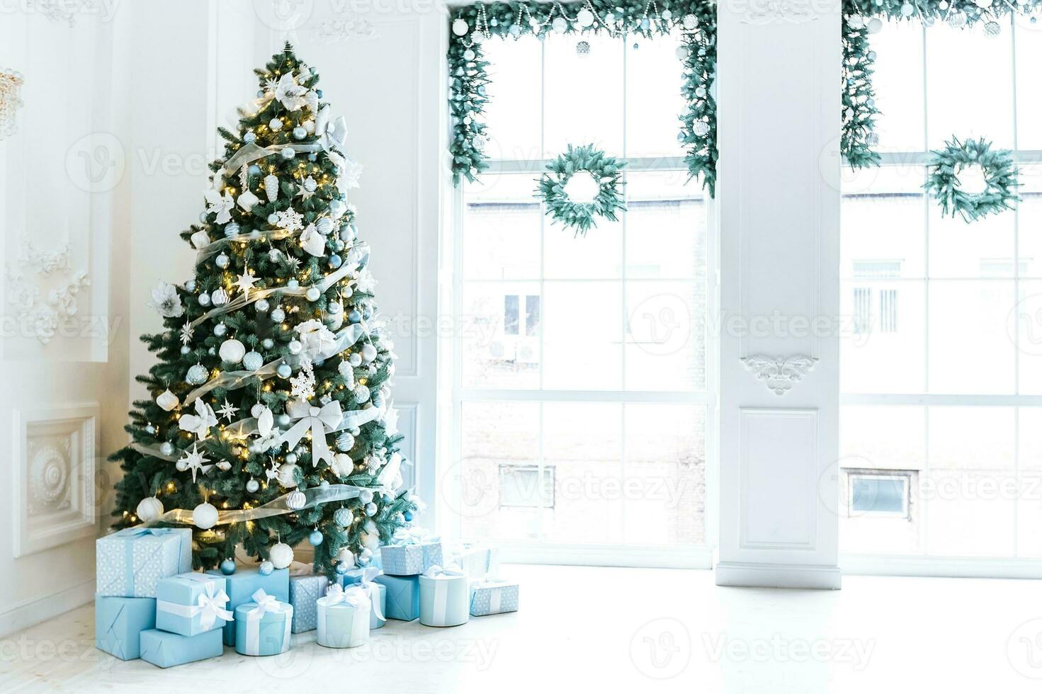 Christmas interior stock photos. Explore warm and inviting holiday themed home settings, adorned with twinkling lights, stockings, and beautifully decorated Christmas trees. photo