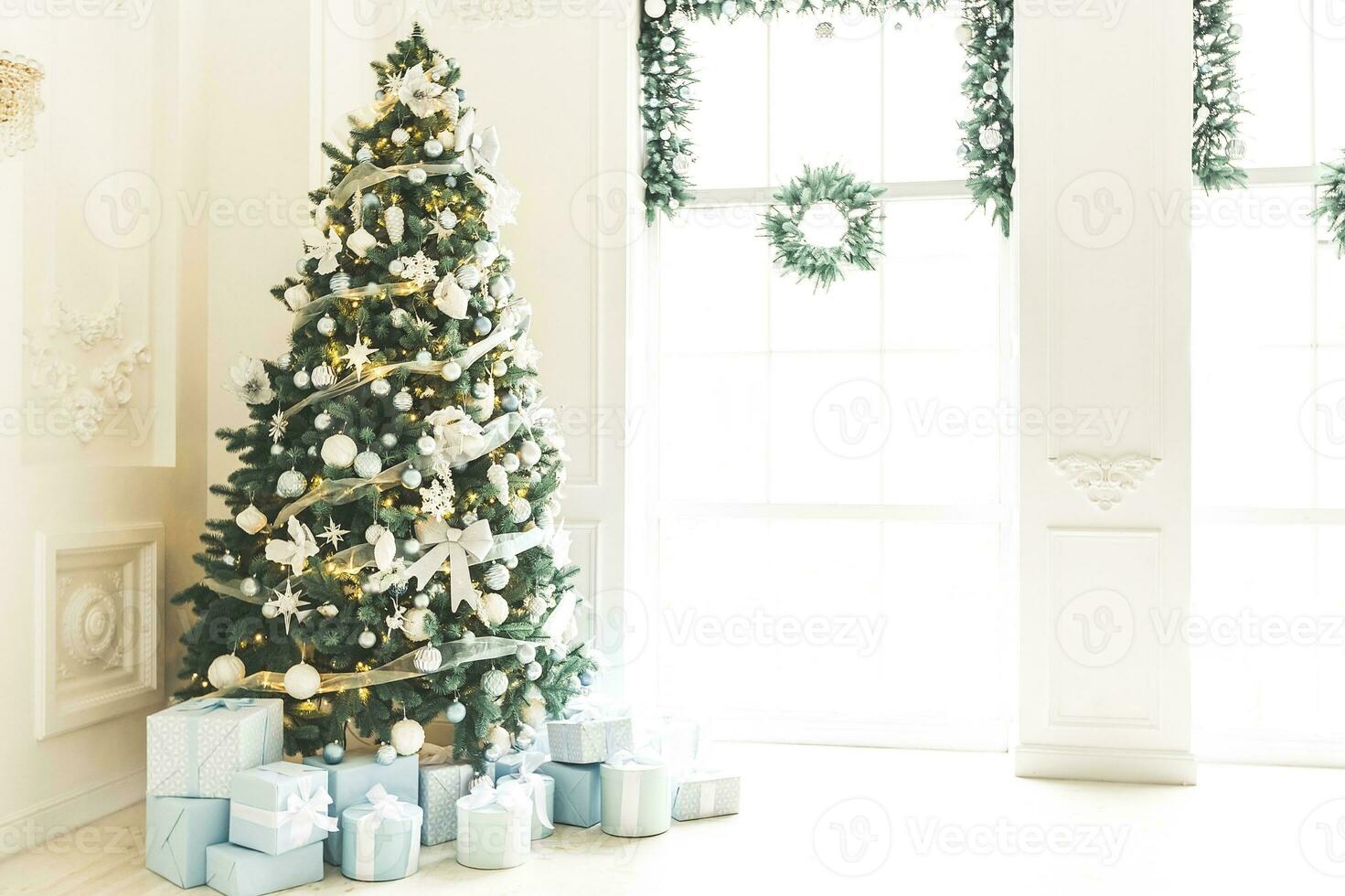 Christmas interior stock photos. Explore warm and inviting holiday themed home settings, adorned with twinkling lights, stockings, and beautifully decorated Christmas trees. photo