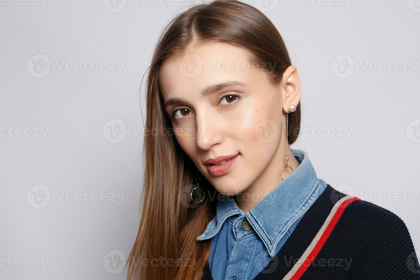 Pretty smiling joyfully female with fair hair, dressed casually photo