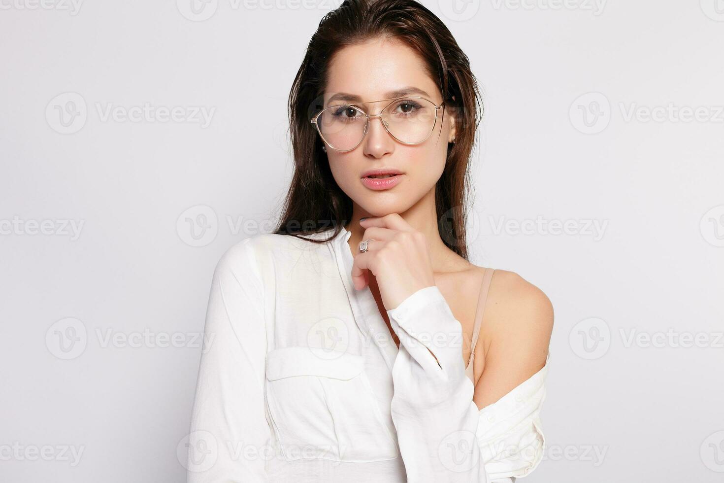 Pretty young girl in white blank t-shirt, wearing glasses photo