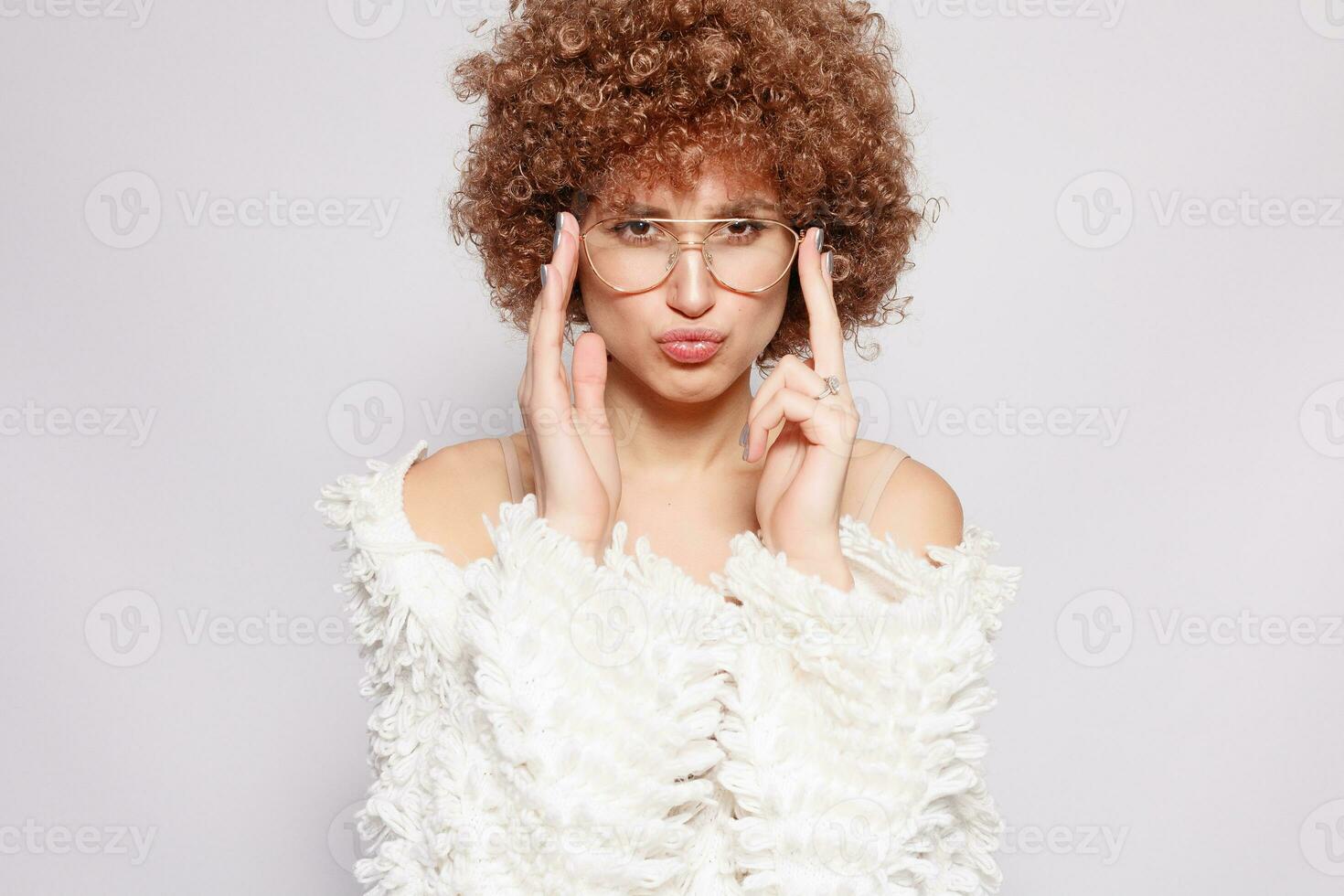 Portrait of smiling young woman with afro hairstyle photo