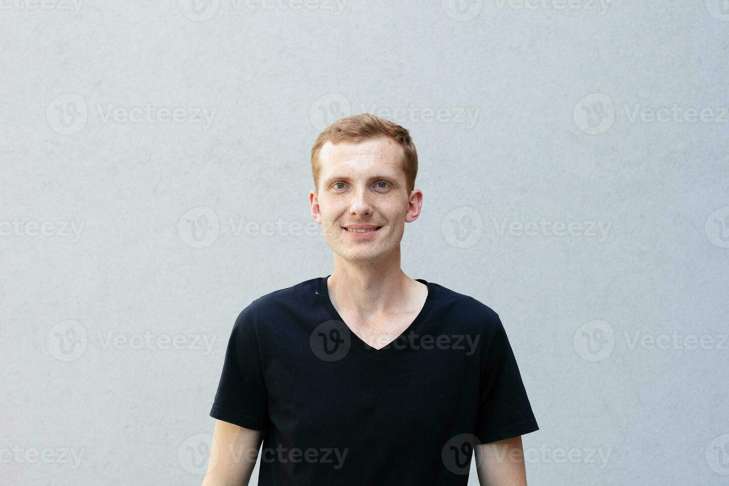 Close up portrait of a redhead of a beautiful manly guy with freckles photo