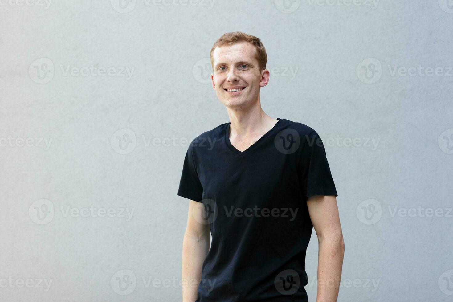 Close up portrait of a redhead of a beautiful manly guy with freckles photo