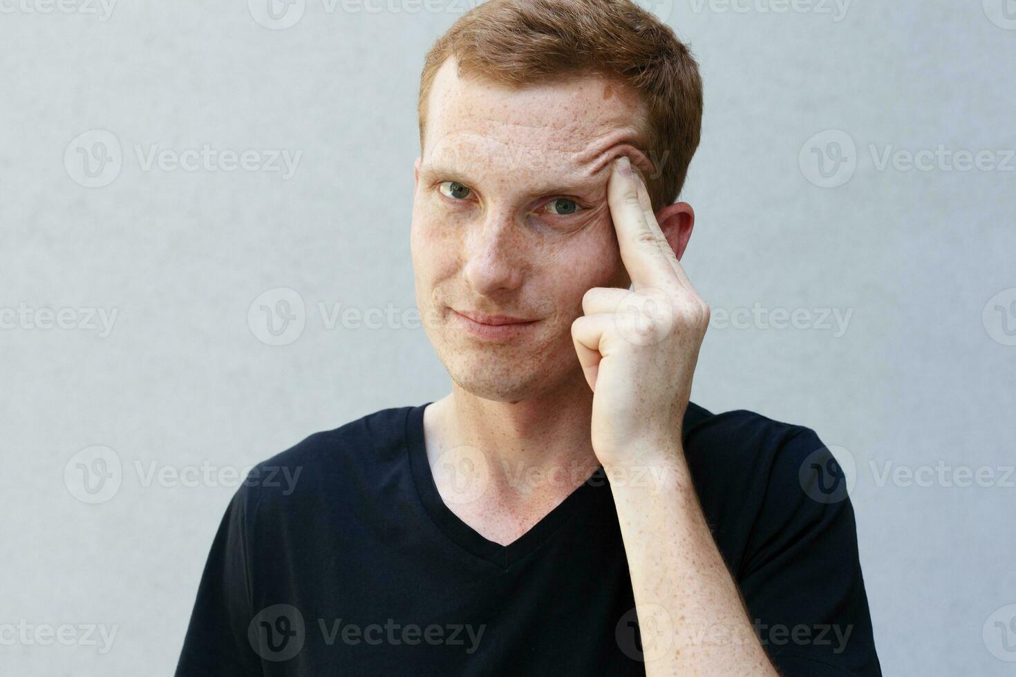 Close up portrait of a redhead of a beautiful manly guy with freckles photo