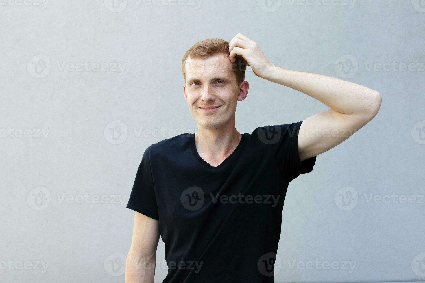 Close up portrait of a redhead of a beautiful manly guy with freckles photo