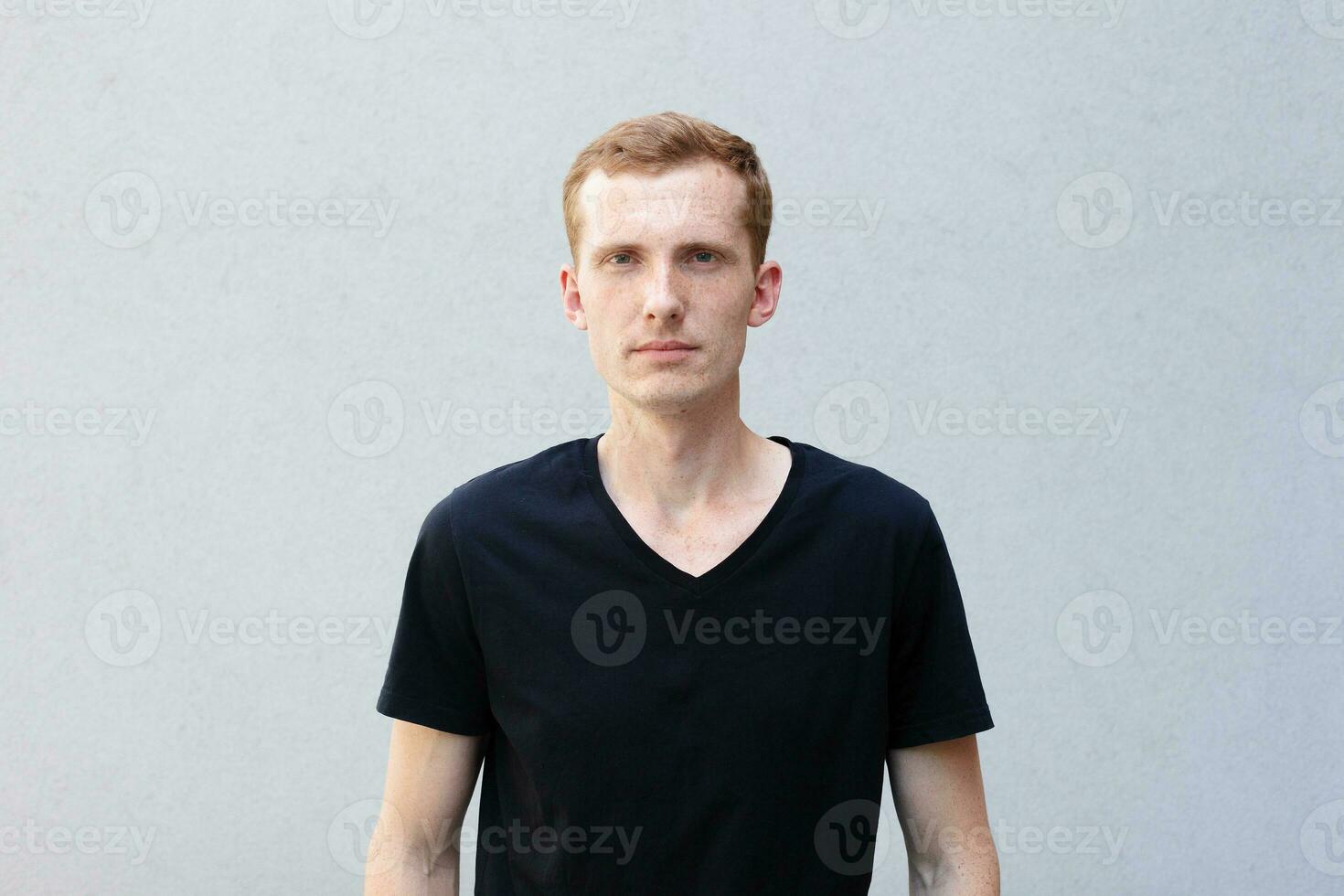 Close up portrait of a redhead of a beautiful manly guy with freckles photo