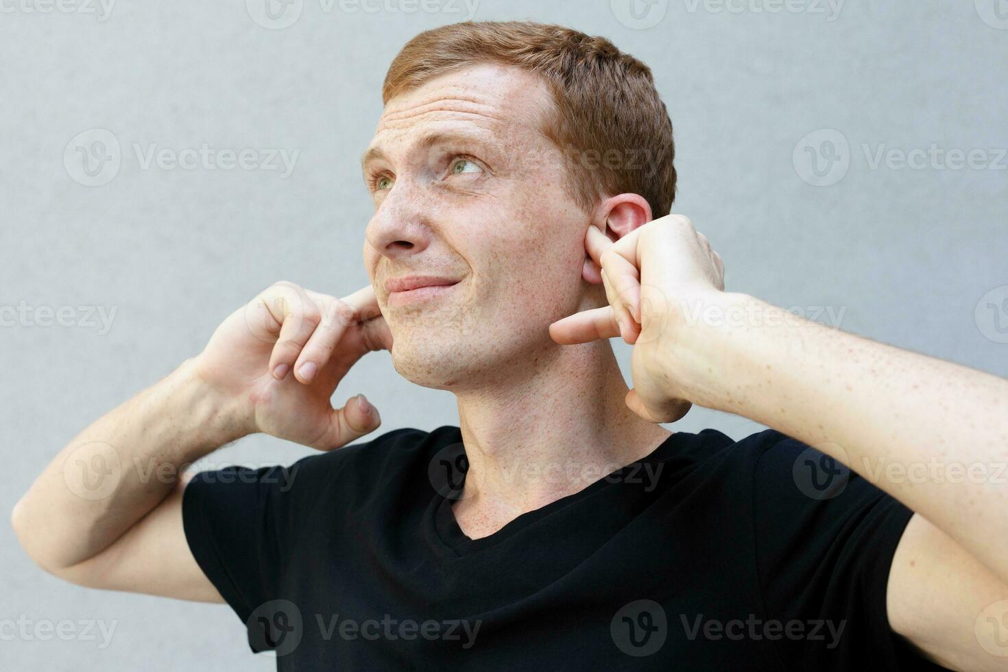 Close up portrait of a redhead of a beautiful manly guy with freckles photo