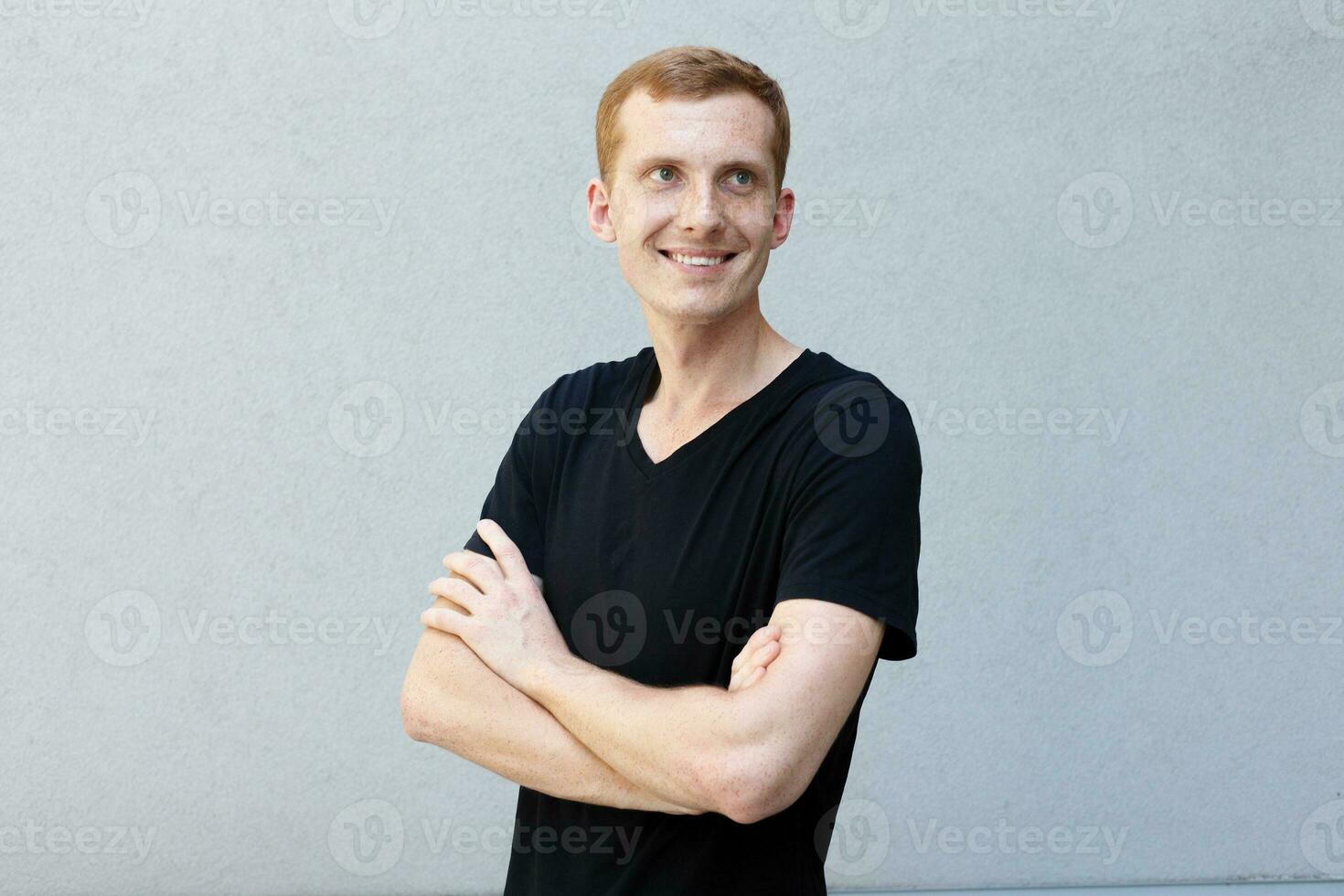 Close up portrait of a redhead of a beautiful manly guy with freckles photo