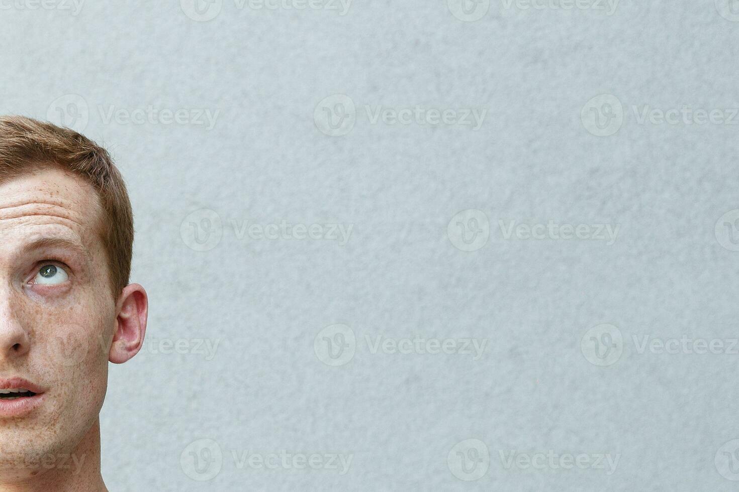 Close up portrait of a redhead of a beautiful manly guy with freckles photo