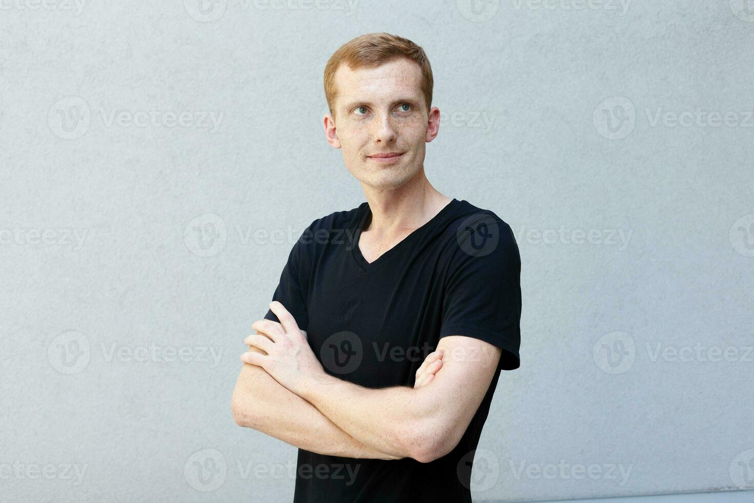 Close up portrait of a redhead of a beautiful manly guy with freckles photo