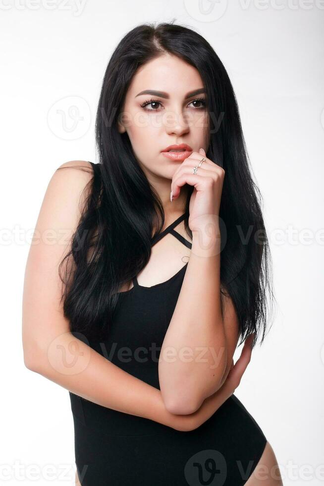 Beautiful young plump woman in black body photo