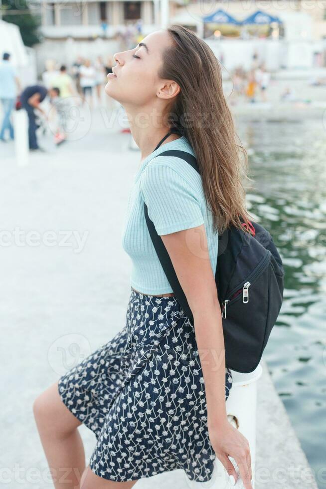 individuality portrait of a beautiful young woman at the sea photo