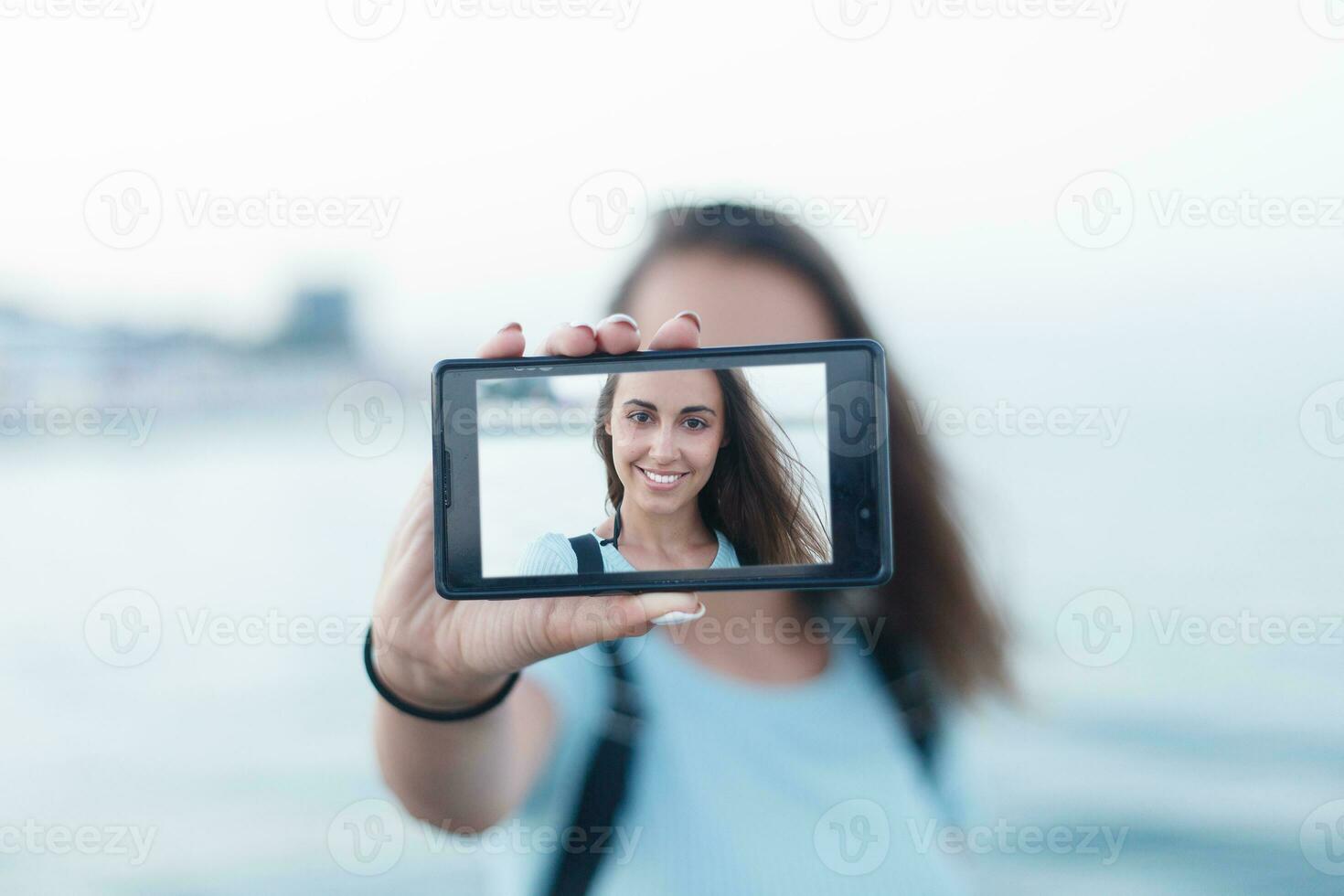 Portrait of attractive teenager girl standing photo